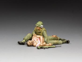 'Taking Care of a Buddy'--two Vietnam-era figures (one seated cradling a prone wounded comrade) #0