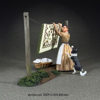 “You Are Really Not Helping!”--Woman Hanging Quilt with Playful Dog, 1855-68--single figure, dog, washing line, basket #0