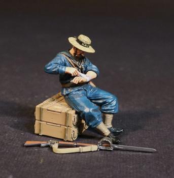 Image of British Naval Brigade Bandaging Hand, H.M.S. Shah, The Eshowe Relief Column, The Battle of Gingindhlovu, 2nd April 1879, The Anglo Zulu War--single figure seated on ammo boxes and gun #52564