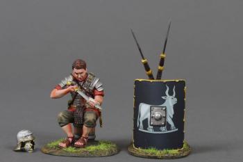 The Swordsman (B)--single Roman Legionary figure in Red tunic sitting on a bucket cleaning his Gladius sword and two pila leaning on 9th Legion black  shield #53058