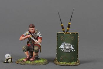 The Swordsman (C)--single Roman Legionary figure in Red tunic sitting on a bucket cleaning his Gladius sword and two pila leaning on 19th Legion green shield #53059