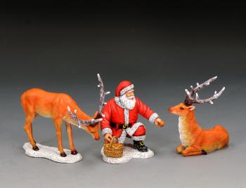 Image of Santa & His Reindeers--single kneeling Santa figure with basket of mushrooms and two reindeer figures #53505