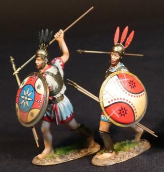 Two Samnite Warriors (white tunics), The Samnites, Armies and Enemies of Ancient Rome--two figures with 2 javelins & round shields in left (red, white, & blue cross on shield, stabbing with javelin; white hourglass on red field onshield, hurling javelin) #53532